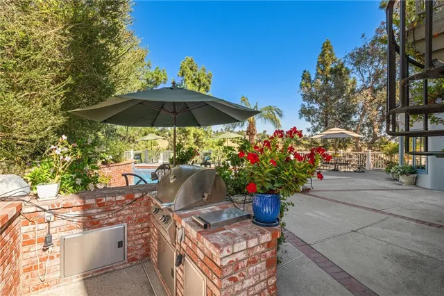 a view of a patio with furniture and a potted plants