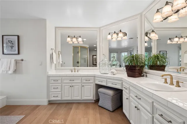 a spacious bathroom with a granite countertop sink a toilet and a mirror