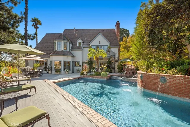 a front view of house with yard outdoor seating and barbeque oven