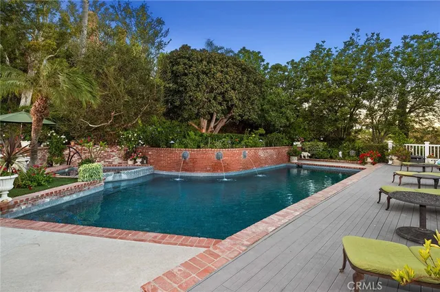 a view of a backyard with sitting area