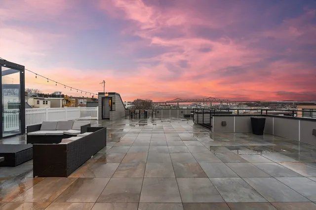 a view of a terrace with outdoor seating