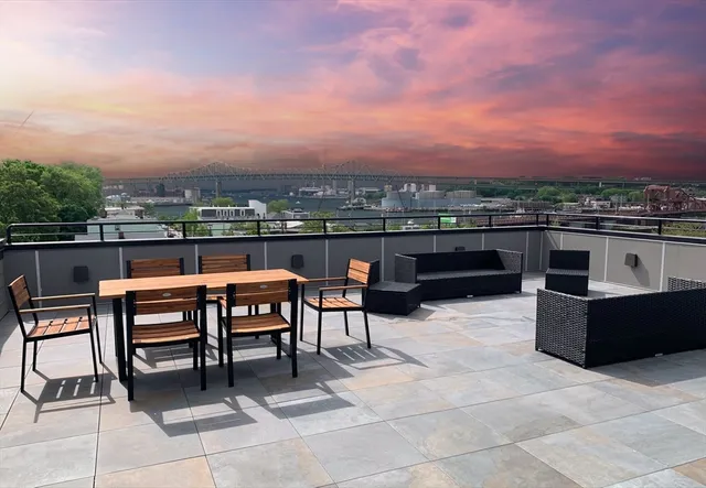 a view of a terrace with furniture
