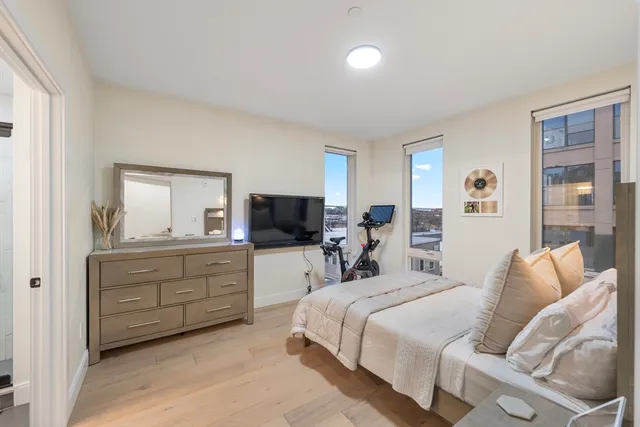 a bedroom with a bed and a television