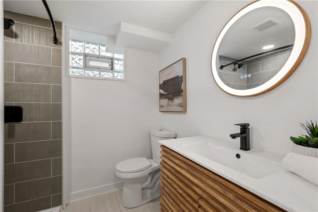 107 Marlboro Road Pittsburgh, PA 15238 - Photo 32 of 45 a bathroom with a toilet a sink and mirror