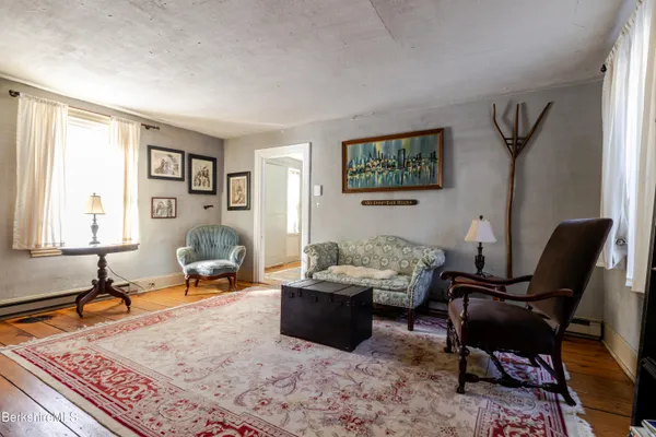 a living room with furniture and a rug