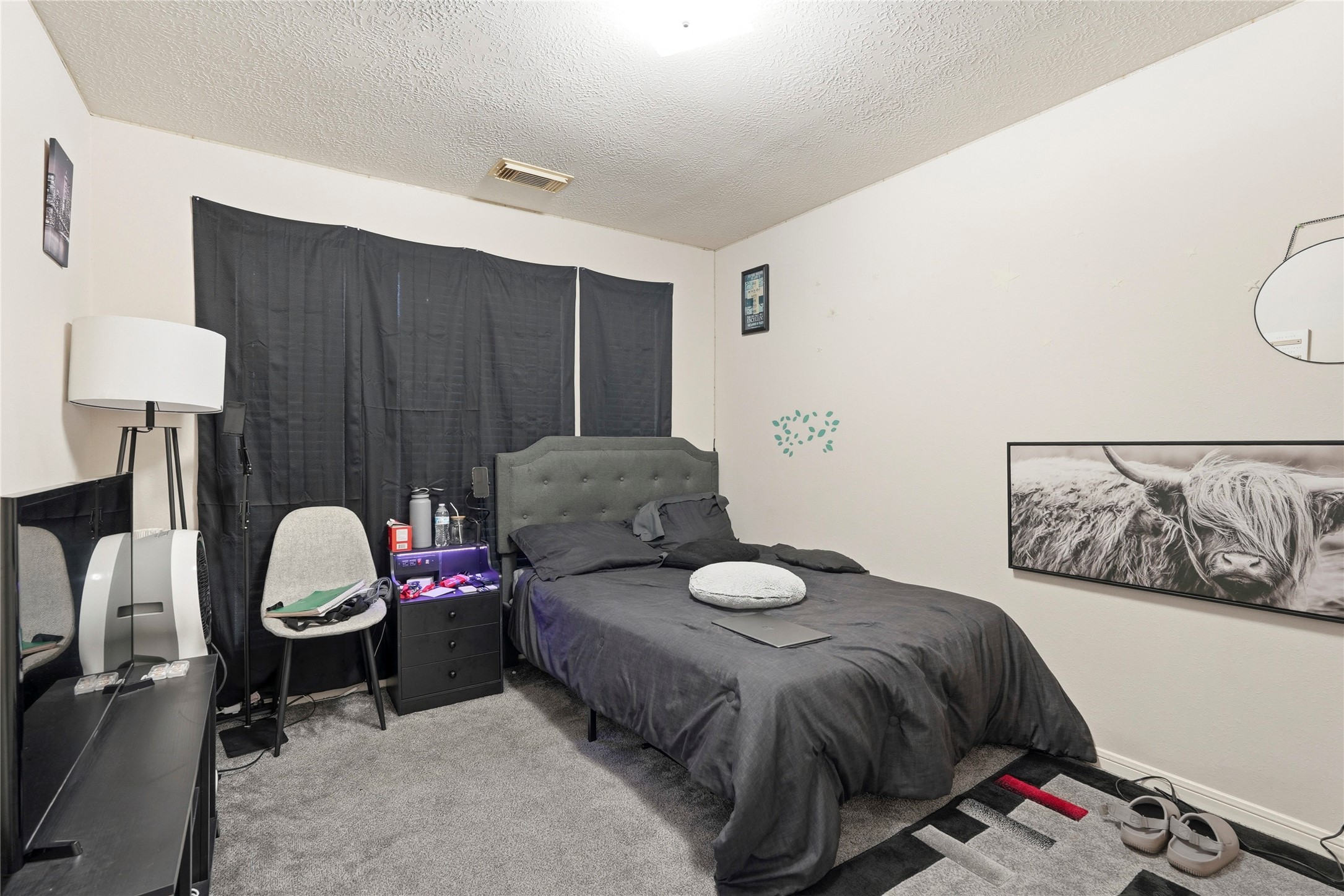 8706 Lone Maple Drive Houston, TX 77083 - Photo 18 of 27 a bedroom with a bed and a lamp