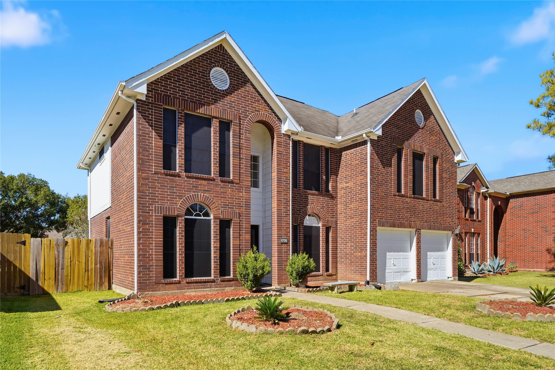 8706 Lone Maple Drive Houston, TX 77083 - Photo 2 of 27 a front view of a house with a yard
