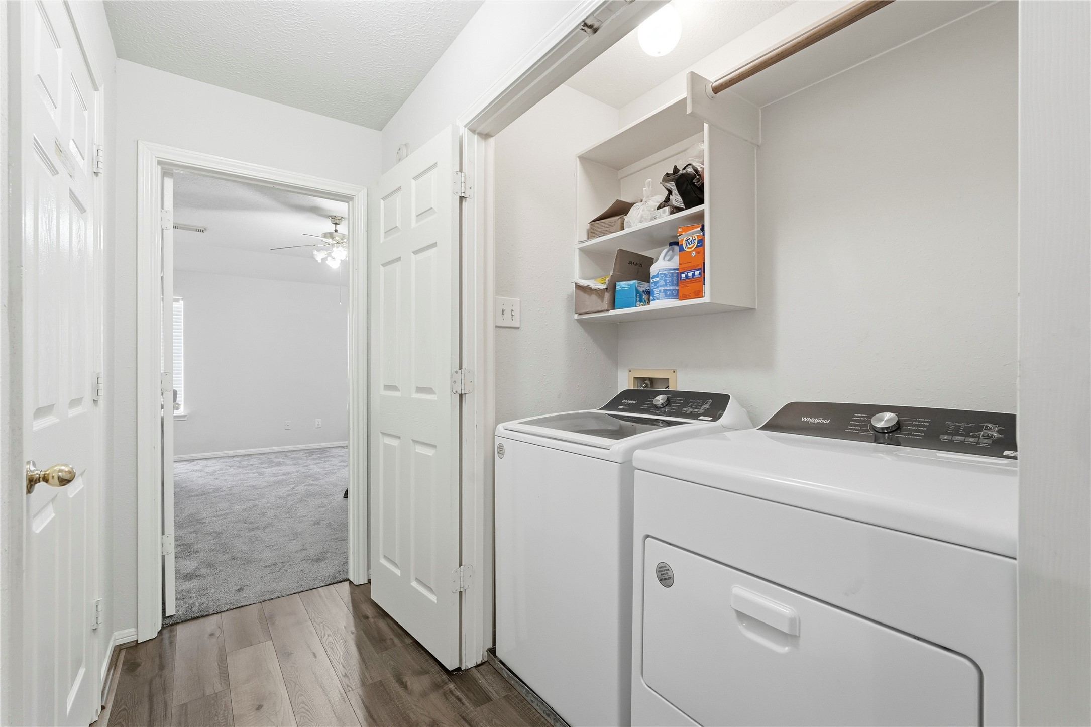 8706 Lone Maple Drive Houston, TX 77083 - Photo 21 of 27 a view of washer and dryer with wooden floor