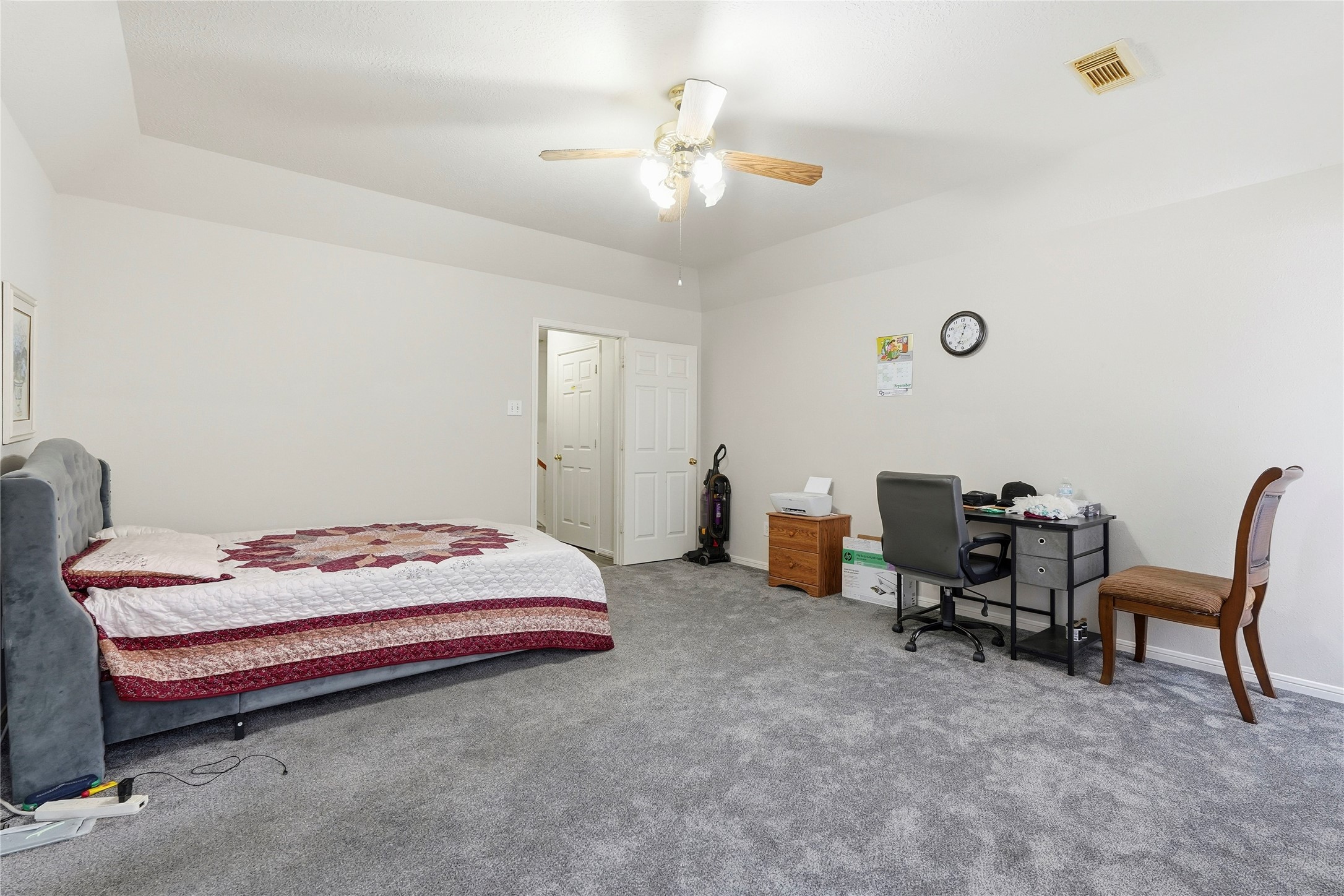 8706 Lone Maple Drive Houston, TX 77083 - Photo 23 of 27 a bedroom with a bed and a chair