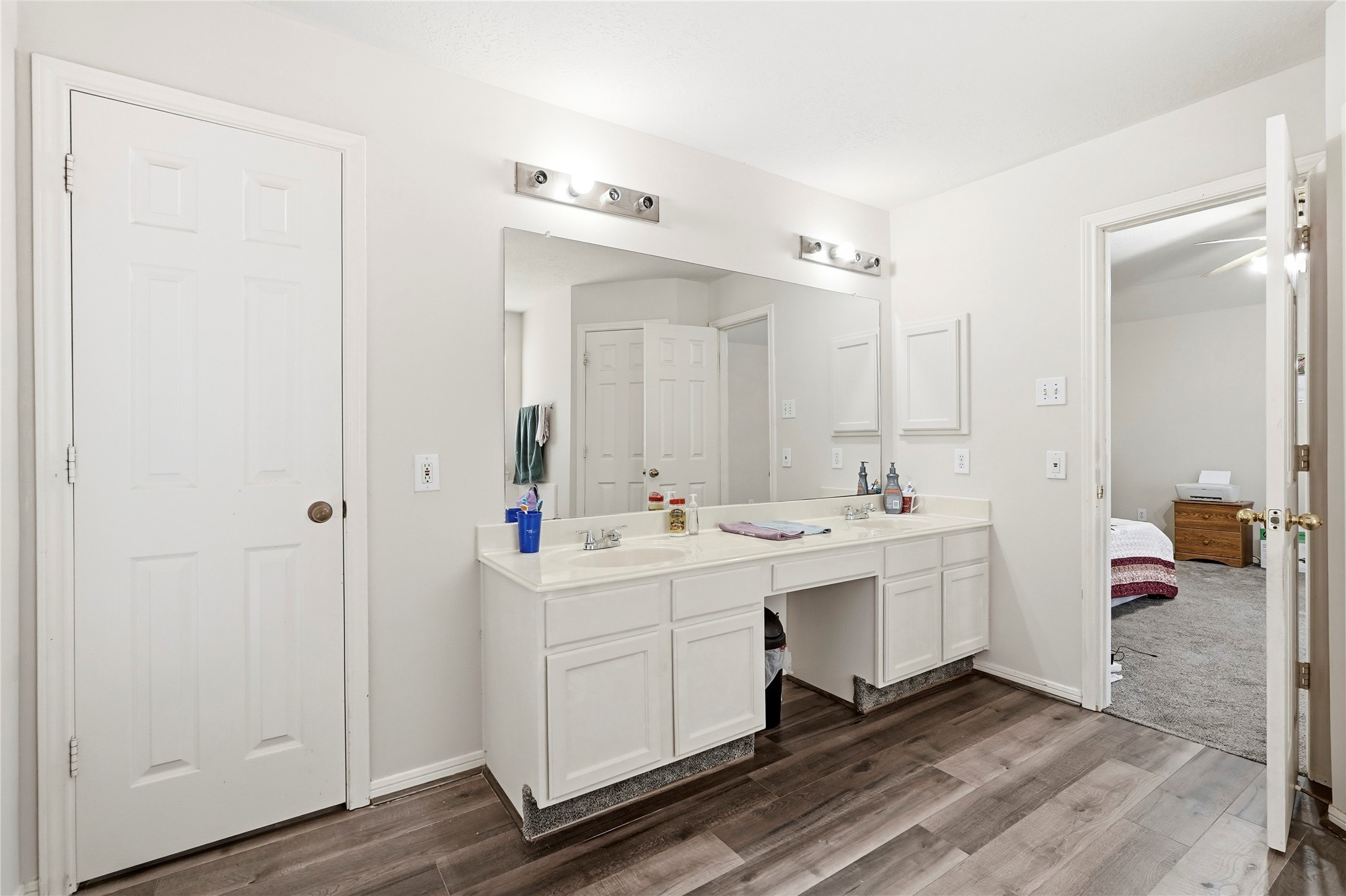 8706 Lone Maple Drive Houston, TX 77083 - Photo 24 of 27 a bathroom with a double vanity sink mirror and toilet
