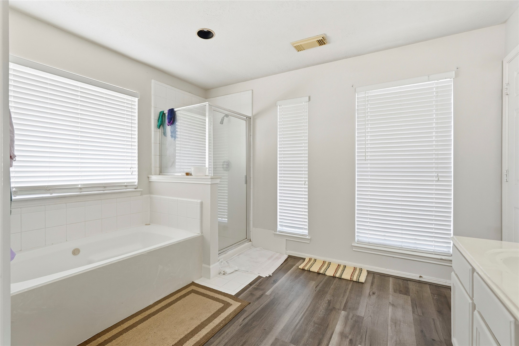 8706 Lone Maple Drive Houston, TX 77083 - Photo 25 of 27 a bathroom with a bathtub and a shower