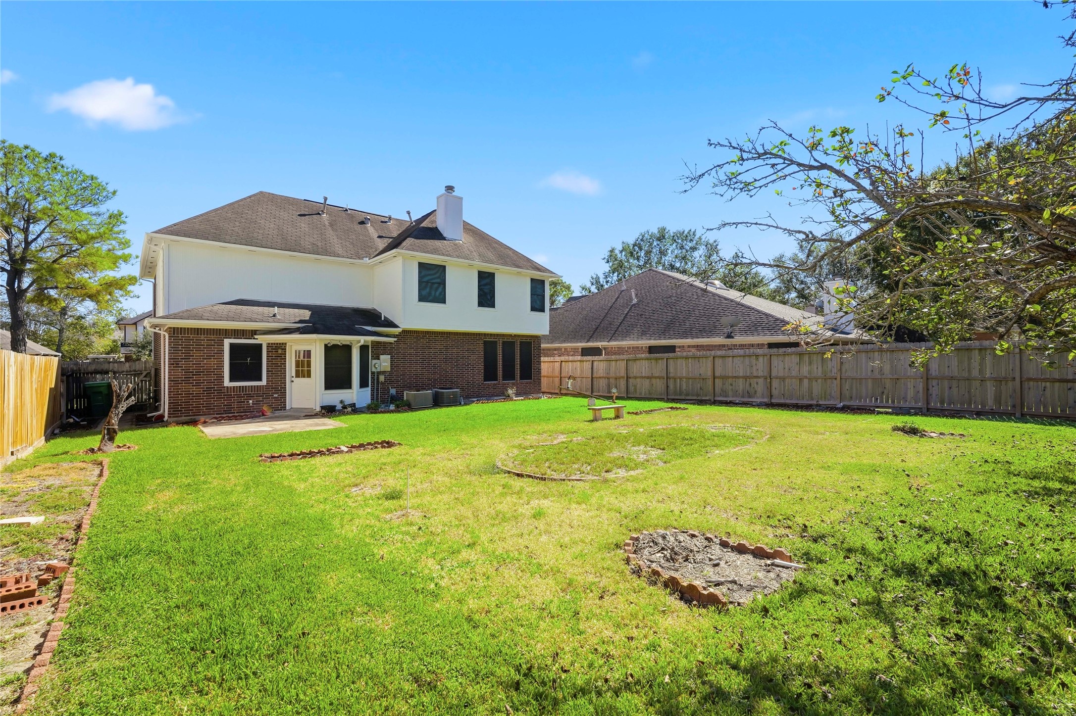 8706 Lone Maple Drive Houston, TX 77083 - Photo 26 of 27 a front view of a house with yard and green space
