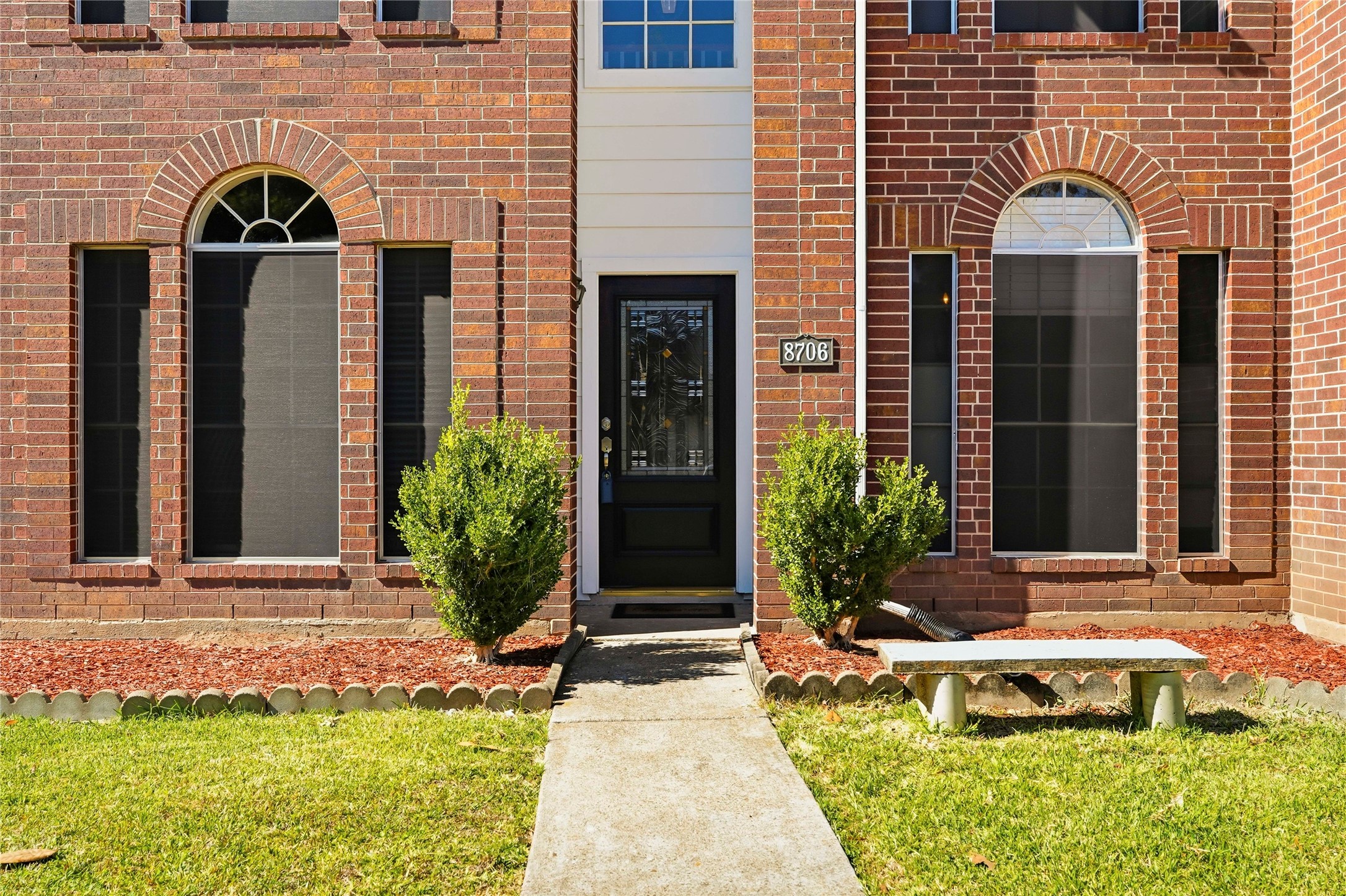 8706 Lone Maple Drive Houston, TX 77083 - Photo 3 of 27 a front view of a house with garden