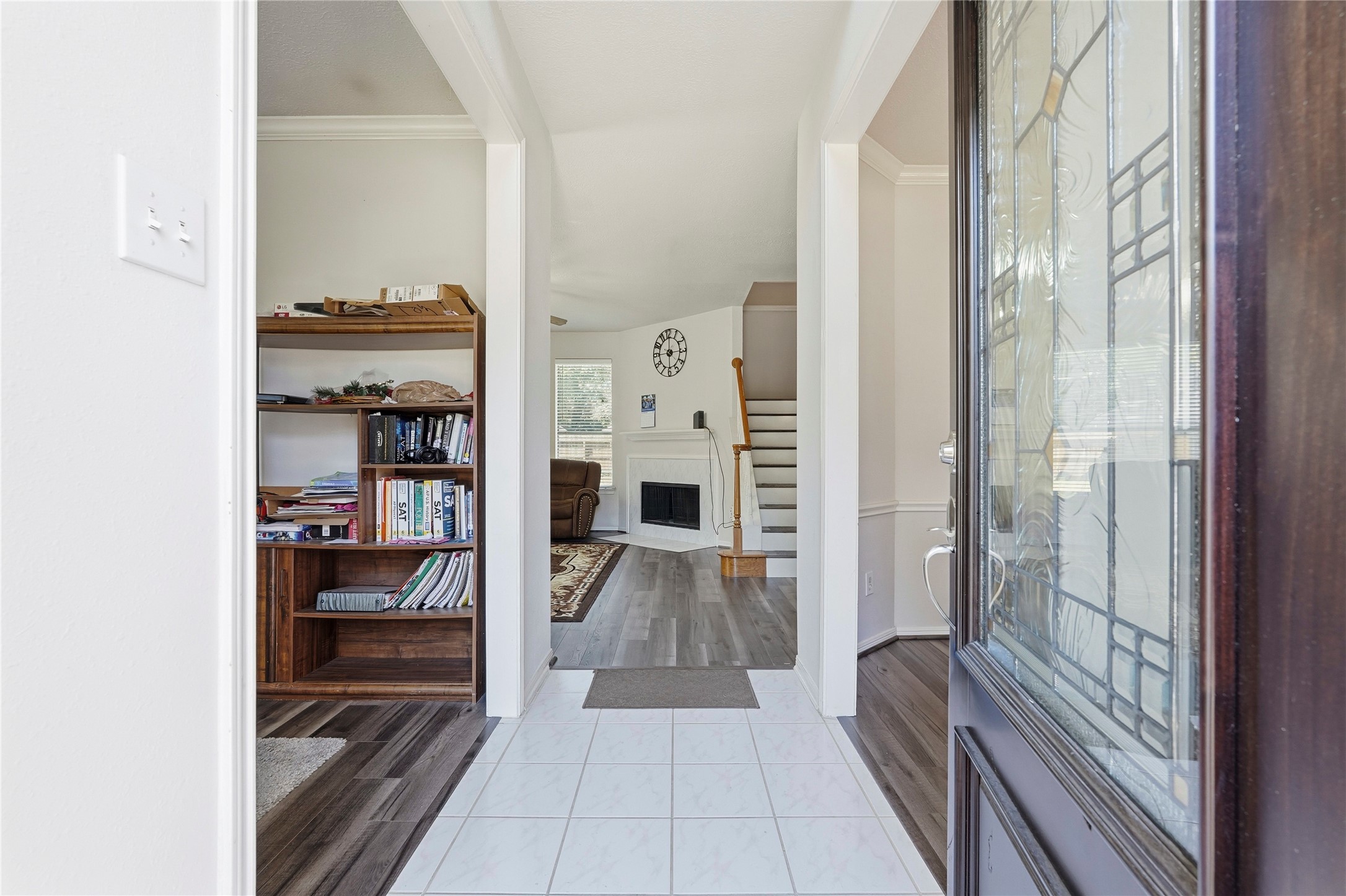 8706 Lone Maple Drive Houston, TX 77083 - Photo 4 of 27 a view of a hallway with wooden floor and windows