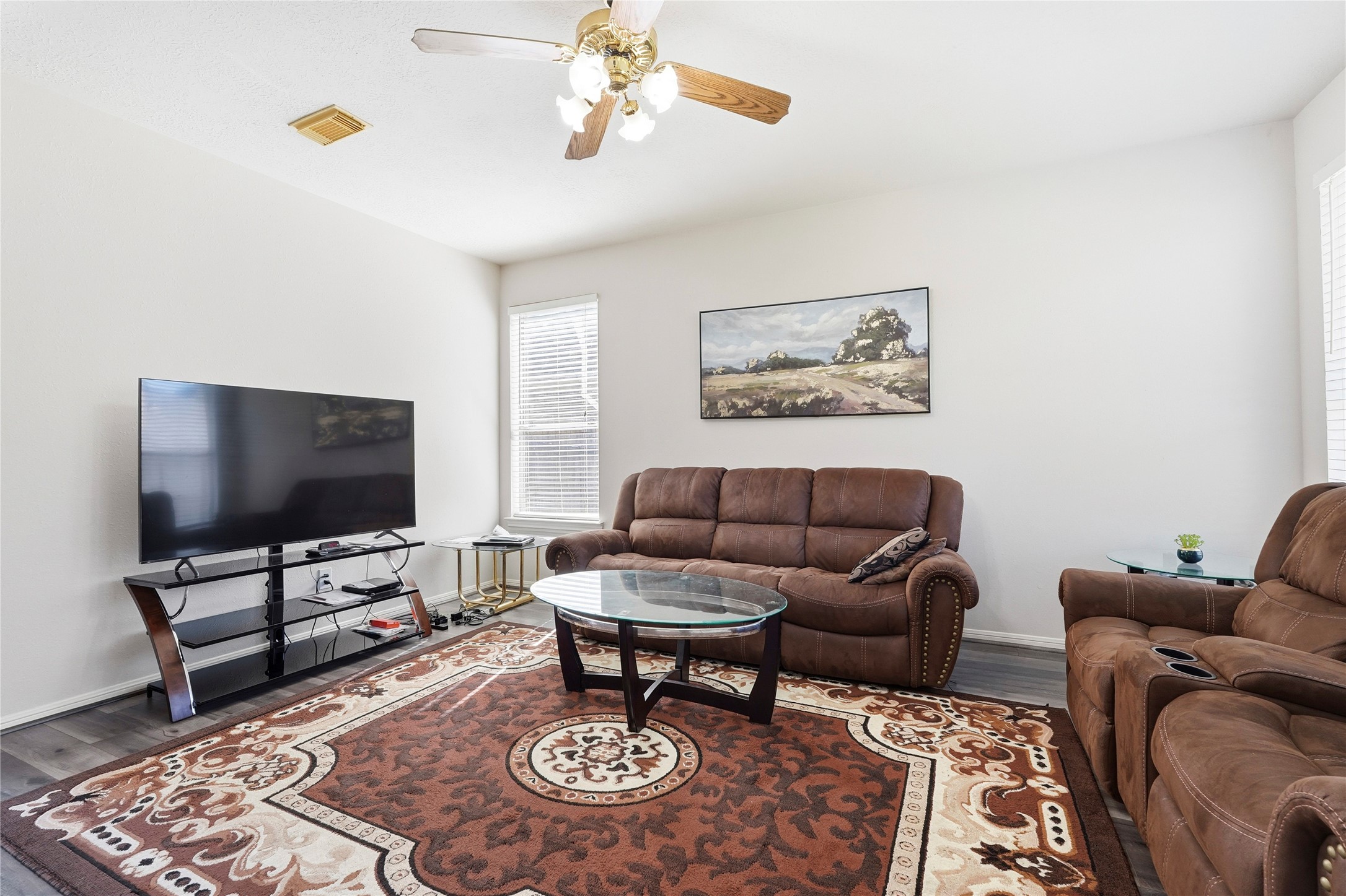 8706 Lone Maple Drive Houston, TX 77083 - Photo 8 of 27 a living room with furniture and a flat screen tv