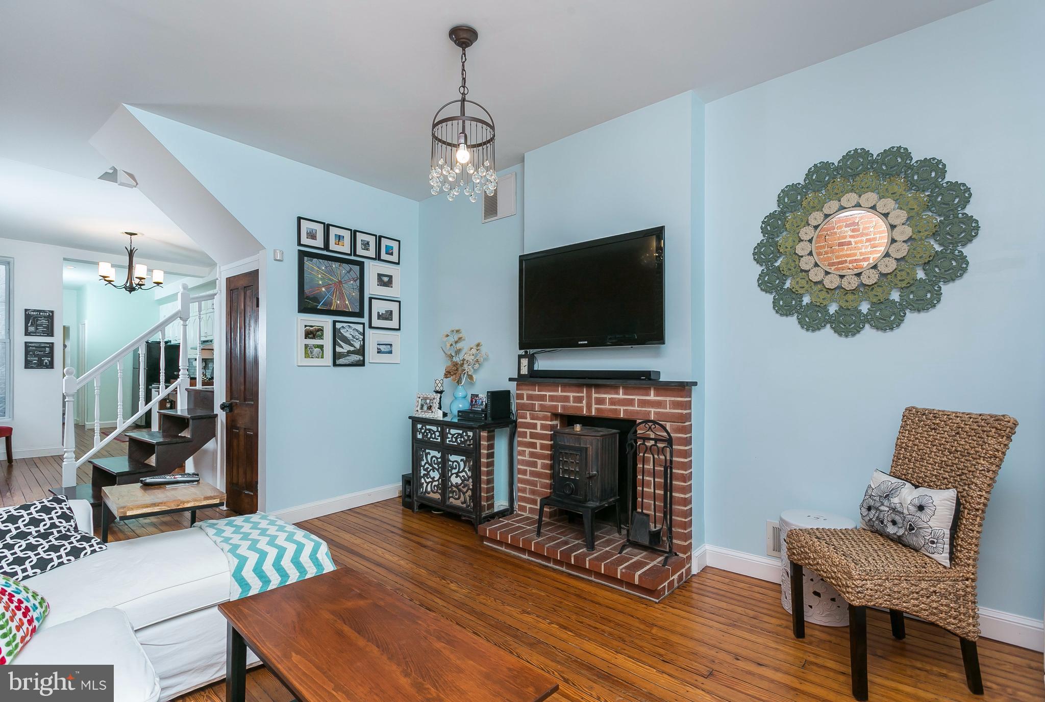 Inviting LR has brick hearth w wood burning stove