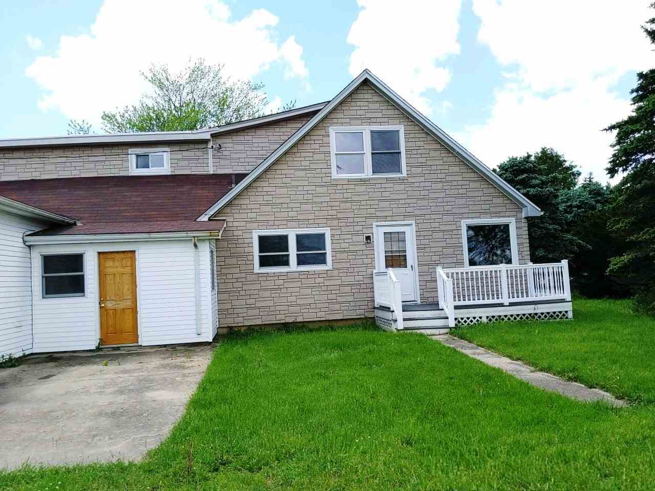 3377 Lee Road Lee, IL 60530 - Photo 1 of 24 a front view of a house with a yard and porch