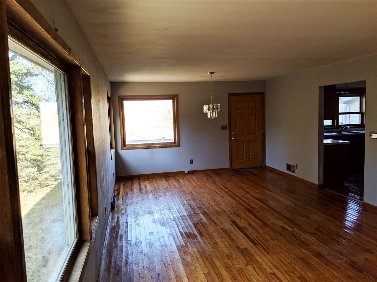 3377 Lee Road Lee, IL 60530 - Photo 9 of 24 a view of an empty room with wooden floor and a window