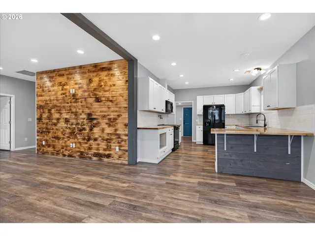 a view of kitchen with wooden floor