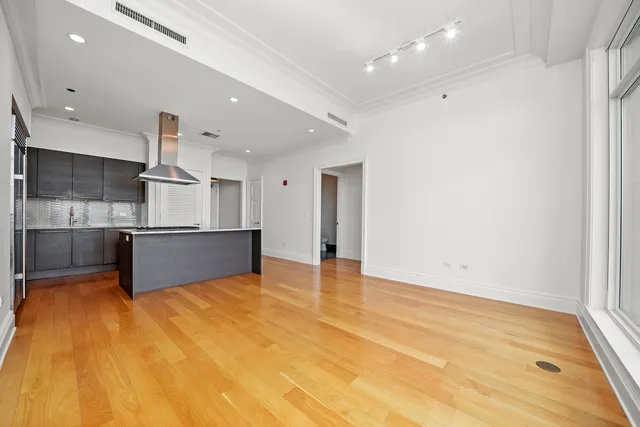 a view of kitchen with kitchen island microwave and stove