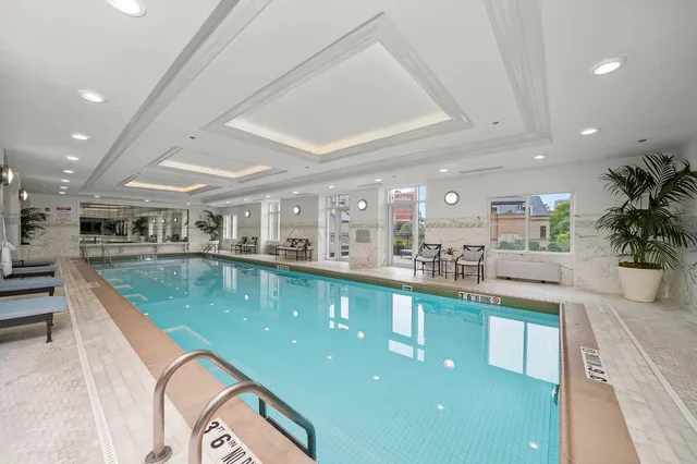 a view of a kitchen with kitchen island and a large window