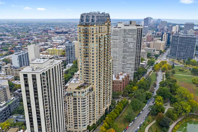 an aerial view of a house swimming pool and garden