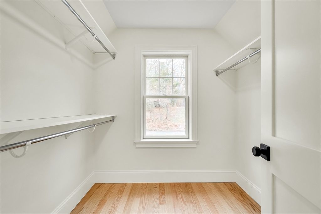 232 Lincoln Street Lexington, MA 02421 - Photo 28 of 41 a view of a room with wooden floor closet and windows