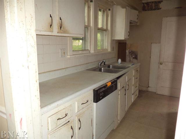212 West Division Street Bloomington, IL 61701 - Photo 3 of 10 a kitchen with a sink and cabinets