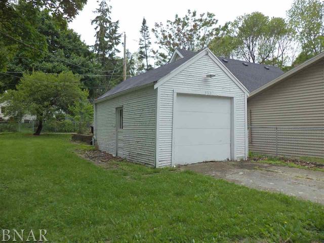 212 West Division Street Bloomington, IL 61701 - Photo 8 of 10 a view of a house with a yard and garage