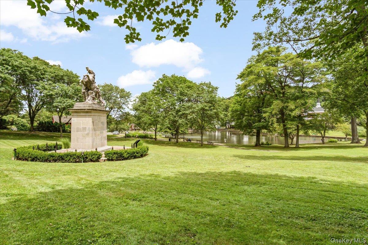 77 Edwards Street, Unit 2A Roslyn Heights, NY 11577 - Photo 26 of 29 a view of a park with large trees