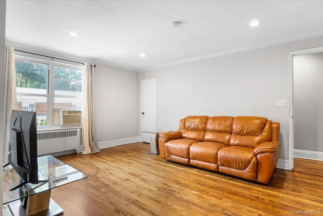 a living room with a couch and a flat screen tv