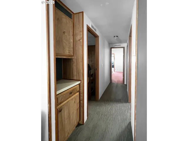 a bathroom with a granite countertop shower sink and mirror