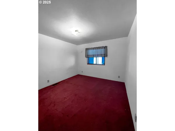 a living room with furniture and a toilet