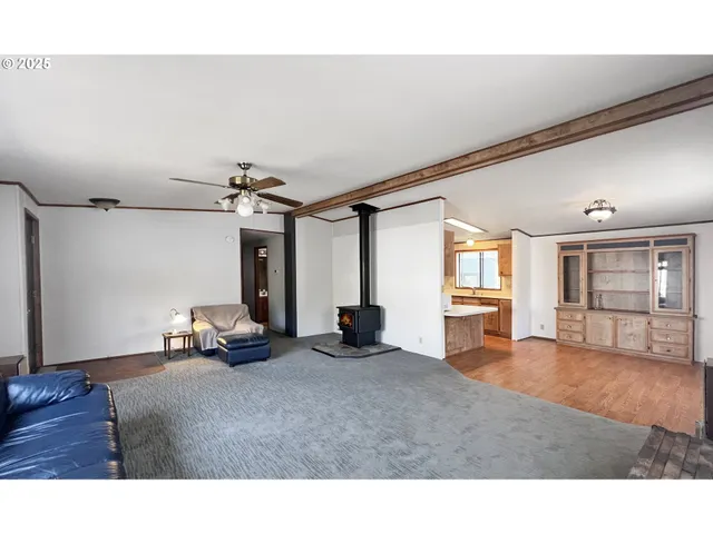 a kitchen with a refrigerator and a sink