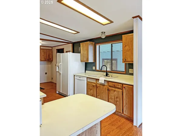 a kitchen that has a sink and a stove