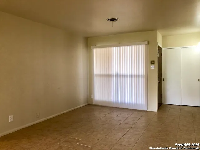 a kitchen with a stove and a refrigerator