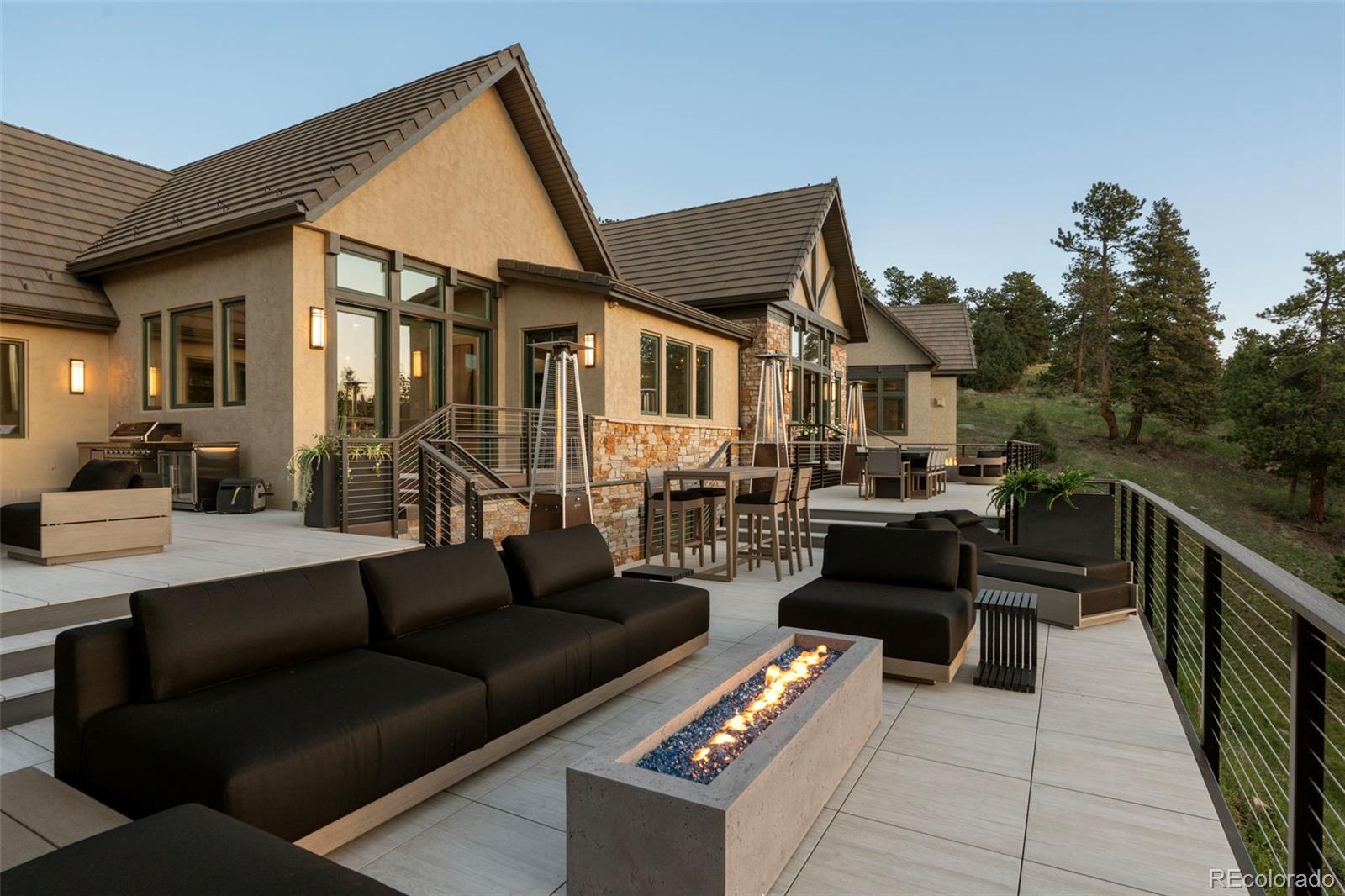 730 Genesee Mountain Road Golden, CO 80401 - Photo 43 of 50 a view of a patio with couches and a potted plant on a table