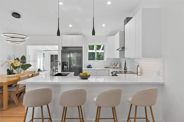 a front view of house with yard and outdoor seating