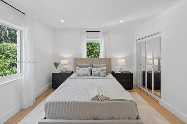 a bedroom with a large bed and a couch