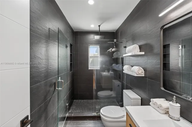 a bedroom with a bed and a night stand