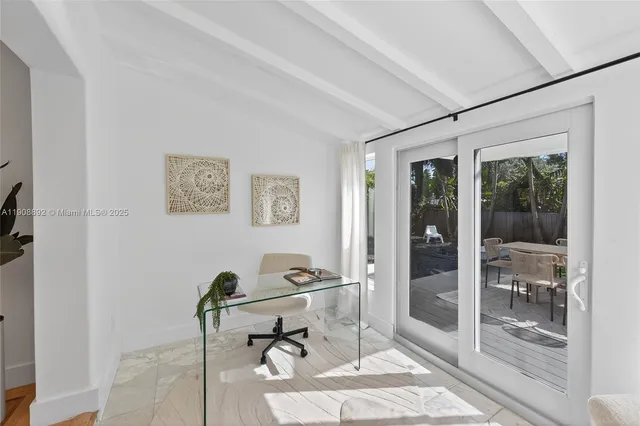 a bedroom with bed and a window