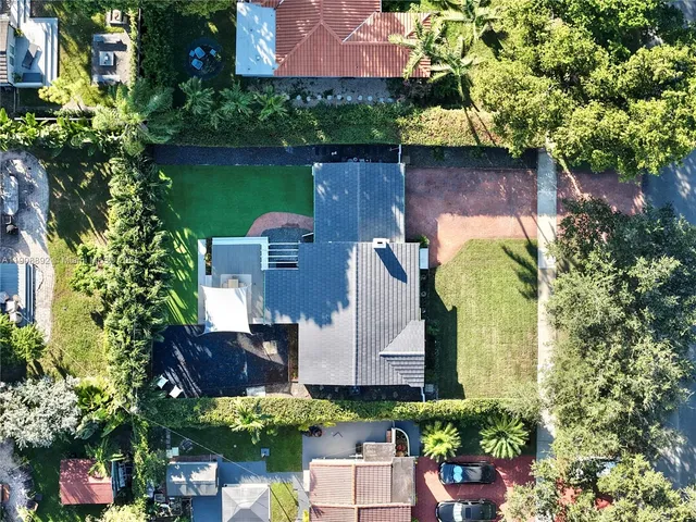 a view of a patio with table and chairs and potted plants