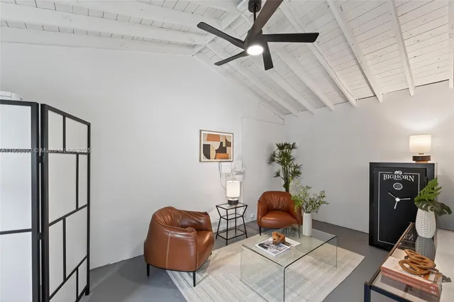 an aerial view of residential houses with city view