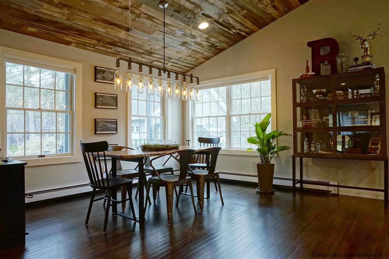 54 Stillwater Road Stone Ridge, NY 12484 - Photo 11 of 35 a dining room with furniture and wooden floor