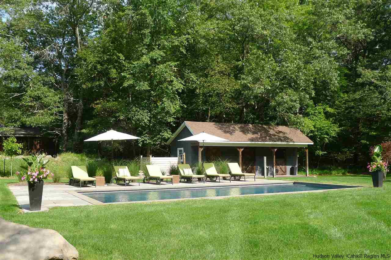 54 Stillwater Road Stone Ridge, NY 12484 - Photo 4 of 35 a view of a table and chairs under an umbrella