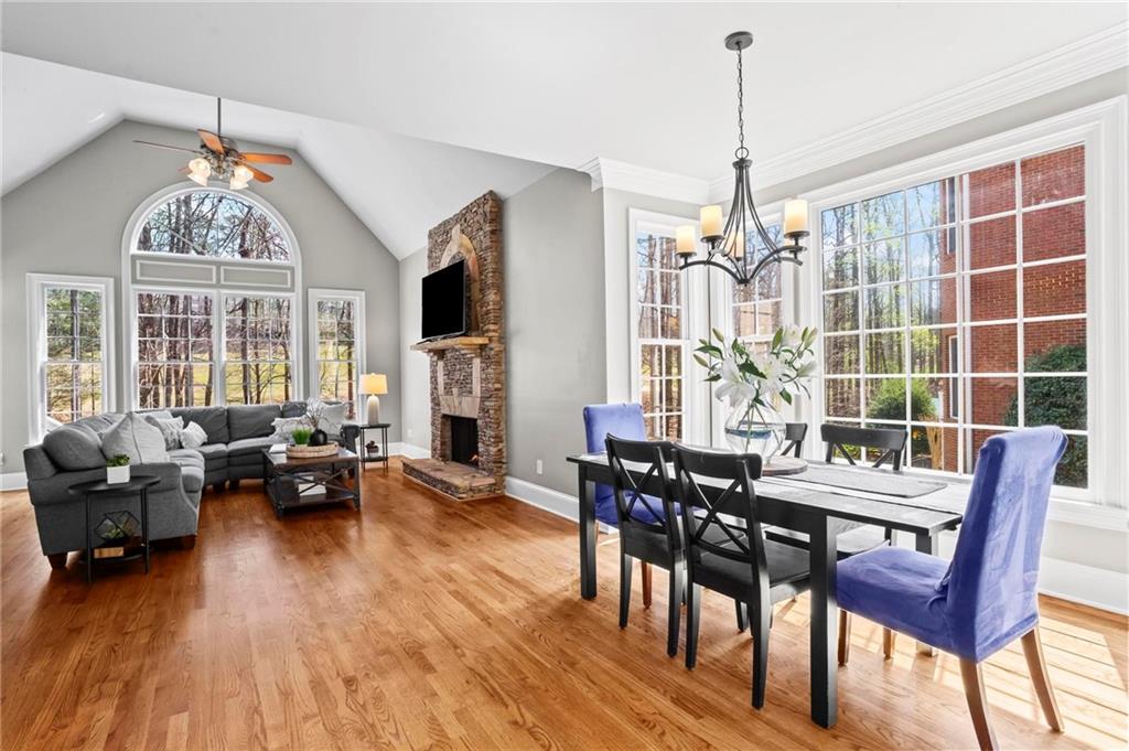 14375 Morning Mountain Way Milton, GA 30004 - Photo 20 of 53 a view of a dining room with furniture window and wooden floor