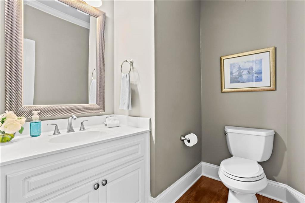 14375 Morning Mountain Way Milton, GA 30004 - Photo 22 of 53 a bathroom with a toilet sink and mirror