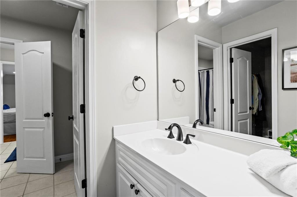 14375 Morning Mountain Way Milton, GA 30004 - Photo 31 of 53 a bathroom with a sink and a mirror