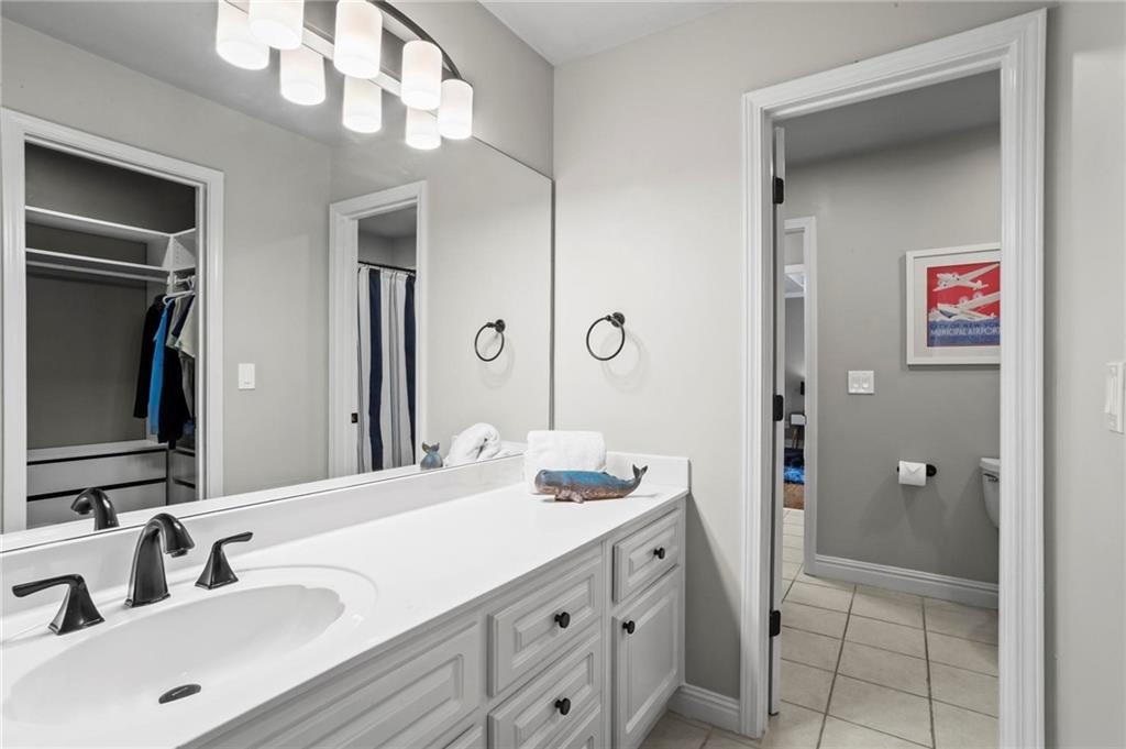 14375 Morning Mountain Way Milton, GA 30004 - Photo 32 of 53 a bathroom with a sink vanity and a mirror
