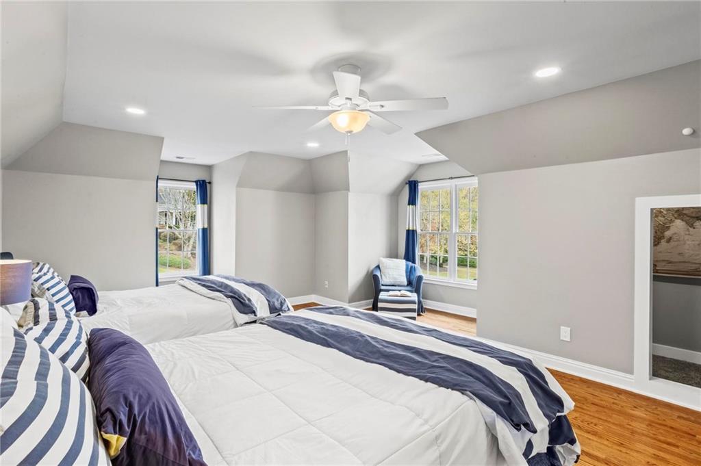 14375 Morning Mountain Way Milton, GA 30004 - Photo 33 of 53 a bedroom with double bed and a chandelier